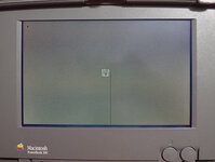 PowerBook-100-half-black-line-on-screen-due-to-loose-bond-wire.jpg
