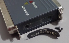 Remove side labels to reveal screws.jpg